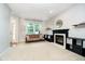 Cozy living room featuring a fireplace, large windows, and comfortable seating at 73 Spring Lake Dr, Westfield, IN 46074