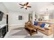 Open-concept living room with a cozy sofa, TV area, and a partial view of the kitchen at 73 Spring Lake Dr, Westfield, IN 46074