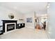 Bright living room with fireplace and ample space, complemented by neutral decor and hardwood floors at 73 Spring Lake Dr, Westfield, IN 46074