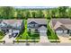 Aerial view of a two-story home highlighting its well-kept lawn and location in a quiet neighborhood at 7319 Farlin Dr, Whitestown, IN 46075