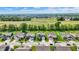 Aerial view of the neighborhood featuring well-maintained homes and green spaces in a suburban setting at 7319 Farlin Dr, Whitestown, IN 46075
