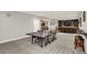 Open concept basement featuring a ping pong table, bar, and media center at 7319 Farlin Dr, Whitestown, IN 46075