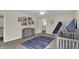 Neutral Bedroom with mountain mural, crib, accent rug, dresser, and natural light at 7319 Farlin Dr, Whitestown, IN 46075