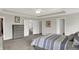 Relaxing main bedroom has plush carpet, tray ceiling, and ensuite entrance at 7319 Farlin Dr, Whitestown, IN 46075