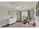 Warm Bedroom features natural light, rocking chair, soft pink accents and decor at 7319 Farlin Dr, Whitestown, IN 46075