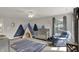 Cozy Bedroom features a mountain mural, crib, plush chair, and natural light at 7319 Farlin Dr, Whitestown, IN 46075