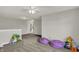 Spacious bonus room offers plush carpeting, neutral walls and ample open space at 7319 Farlin Dr, Whitestown, IN 46075