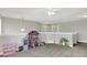 Large bonus room is ideal for recreation, offering soft carpet and neutral paint at 7319 Farlin Dr, Whitestown, IN 46075