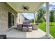 Covered patio with outdoor seating and sliding glass door to the house at 7319 Farlin Dr, Whitestown, IN 46075