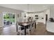 Bright kitchen area with modern white cabinets, hardwood flooring, and a center island with seating at 7319 Farlin Dr, Whitestown, IN 46075
