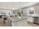 Open concept kitchen, dining and living area showing the natural flow from the kitchen island to the living space at 7319 Farlin Dr, Whitestown, IN 46075