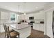 A modern kitchen featuring an island, stainless steel appliances, and ample white cabinetry for a clean and inviting space at 7319 Farlin Dr, Whitestown, IN 46075