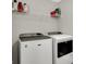 Well-equipped laundry area showcasing modern Maytag washer and dryer units, plus convenient shelving for storage at 7319 Farlin Dr, Whitestown, IN 46075