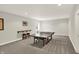Bright, spacious basement area with a ping pong table and natural light at 7319 Farlin Dr, Whitestown, IN 46075