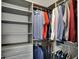 Organized walk-in closet with shelving and hanging racks for ample clothing storage at 7319 Farlin Dr, Whitestown, IN 46075