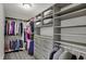 Custom walk-in closet includes shelves, drawers, and hanging space for organization at 7319 Farlin Dr, Whitestown, IN 46075