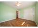 Bedroom with hardwood floors, white trim, ceiling fan and a closet with natural light at 7450 Cotherstone Ct, Indianapolis, IN 46256