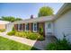 Inviting entrance with charming front door, brick accents, and meticulous landscaping at 7450 Cotherstone Ct, Indianapolis, IN 46256