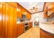 Well-equipped kitchen with stainless steel appliances, modern backsplash, and wood cabinets at 7450 Cotherstone Ct, Indianapolis, IN 46256
