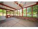 Bright sunroom with exposed brick wall, large windows and a fan at 7450 Cotherstone Ct, Indianapolis, IN 46256