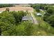 Lovely aerial view of the property with a large yard, an outbuilding and surrounding farmland at 8555 S County Road 375 E, Mooresville, IN 46158