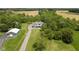 Aerial view of a stunning house with lush greenery and long driveway at 8555 S County Road 375 E, Mooresville, IN 46158