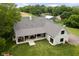 Overhead aerial view of the home, showing the back patio, sprawling lawn, and roofline at 8555 S County Road 375 E, Mooresville, IN 46158