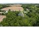 Overhead view of the property, nestled in a serene setting with farmland and abundant trees at 8555 S County Road 375 E, Mooresville, IN 46158