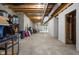 Unfinished basement with exposed ceiling, concrete floor, providing blank canvas for storage or personalized buildout at 8555 S County Road 375 E, Mooresville, IN 46158