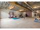 Unfinished basement with concrete floor, exposed ceiling, and ample space for storage and recreational activities at 8555 S County Road 375 E, Mooresville, IN 46158