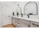 Elegant bathroom with dual sinks, black fixtures, framed mirrors, and plenty of counter space at 8555 S County Road 375 E, Mooresville, IN 46158