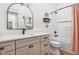Bright bathroom featuring a vanity with a quartz countertop, modern fixtures, and a shower-tub combination at 8555 S County Road 375 E, Mooresville, IN 46158