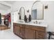 Bathroom featuring double sinks, modern fixtures, and custom wood vanity at 8555 S County Road 375 E, Mooresville, IN 46158