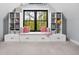 Cozy window seat with built-in storage and shelves, creating a charming reading nook in the bedroom at 8555 S County Road 375 E, Mooresville, IN 46158