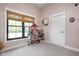 Bright bedroom with a large window, neutral walls, and a dollhouse at 8555 S County Road 375 E, Mooresville, IN 46158