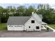 Stylish two-story house with a three-car garage and a charming front porch at 8555 S County Road 375 E, Mooresville, IN 46158
