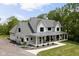 Charming exterior view of the home with a covered front porch and a well-kept lawn at 8555 S County Road 375 E, Mooresville, IN 46158