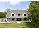 Beautiful exterior shot of the home, featuring a welcoming front porch and impeccable landscaping at 8555 S County Road 375 E, Mooresville, IN 46158