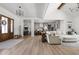 Spacious open-concept living area showcasing hardwood floors, white walls, and modern furniture for a stylish, airy feel at 8555 S County Road 375 E, Mooresville, IN 46158