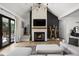 Cozy living room featuring a floor-to-ceiling fireplace, wooden accents, and neutral furniture for a modern design at 8555 S County Road 375 E, Mooresville, IN 46158