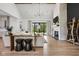 Bright and airy living room with a stone fireplace, hardwood floors, and large windows overlooking the backyard at 8555 S County Road 375 E, Mooresville, IN 46158