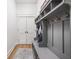 Well-organized mudroom with custom shelving, hooks, and bench seating for convenient storage at 8555 S County Road 375 E, Mooresville, IN 46158