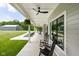 Inviting covered porch with rocking chairs and hanging plants, perfect for relaxing and enjoying the outdoors at 8555 S County Road 375 E, Mooresville, IN 46158