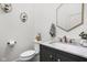 Stylish powder room with a marble countertop, modern fixtures, and tasteful wall decor at 8555 S County Road 375 E, Mooresville, IN 46158