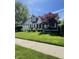 Beautiful home with lush green lawn and a well-maintained landscape at 8655 Chateaugay Dr, Indianapolis, IN 46217