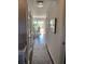 Bright hallway leading to a dining area with a patio view, enhancing the sense of space and light at 8655 Chateaugay Dr, Indianapolis, IN 46217