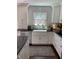 Inviting kitchen featuring a farmhouse sink and stainless steel appliances at 8655 Chateaugay Dr, Indianapolis, IN 46217