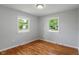 Bright bedroom featuring hardwood floors and two windows that offers plenty of sunlight at 895 W Poplar St, Zionsville, IN 46077
