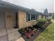 Charming home exterior with brick facade, well-maintained landscaping and vibrant flowerbeds at 895 W Poplar St, Zionsville, IN 46077