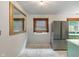 Modern kitchen with marble floors and a stainless steel refrigerator at 895 W Poplar St, Zionsville, IN 46077